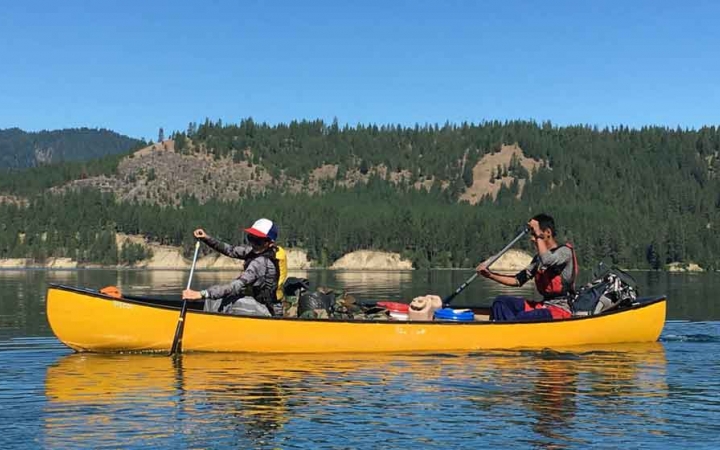 teens learning canoeing skills